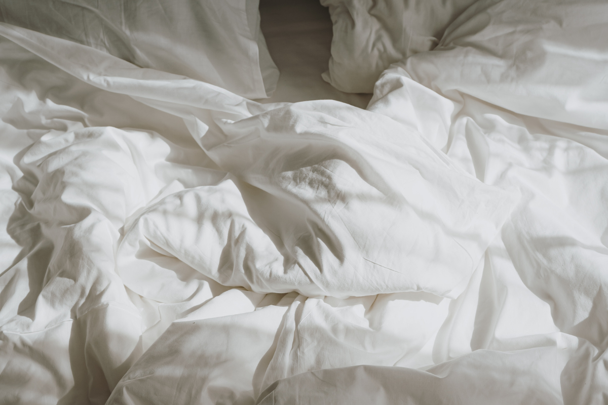 Close-up of crumpled white bedding