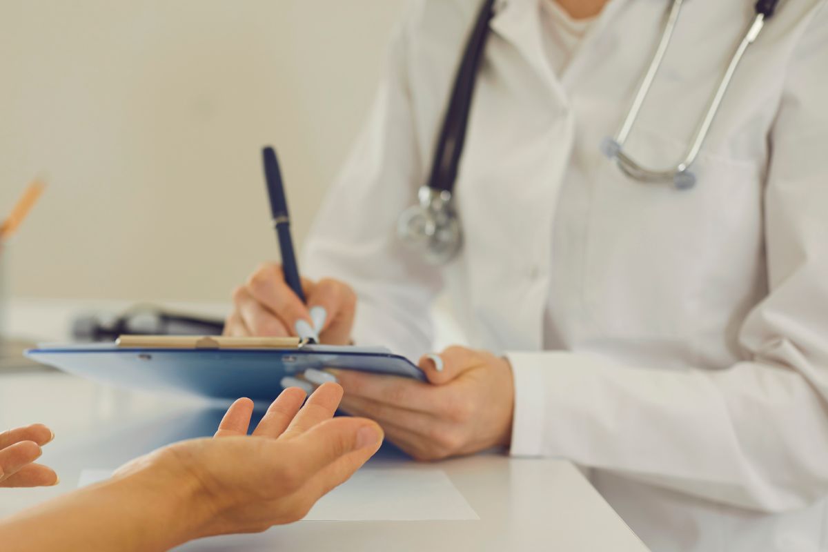 Healthcare professional taking notes